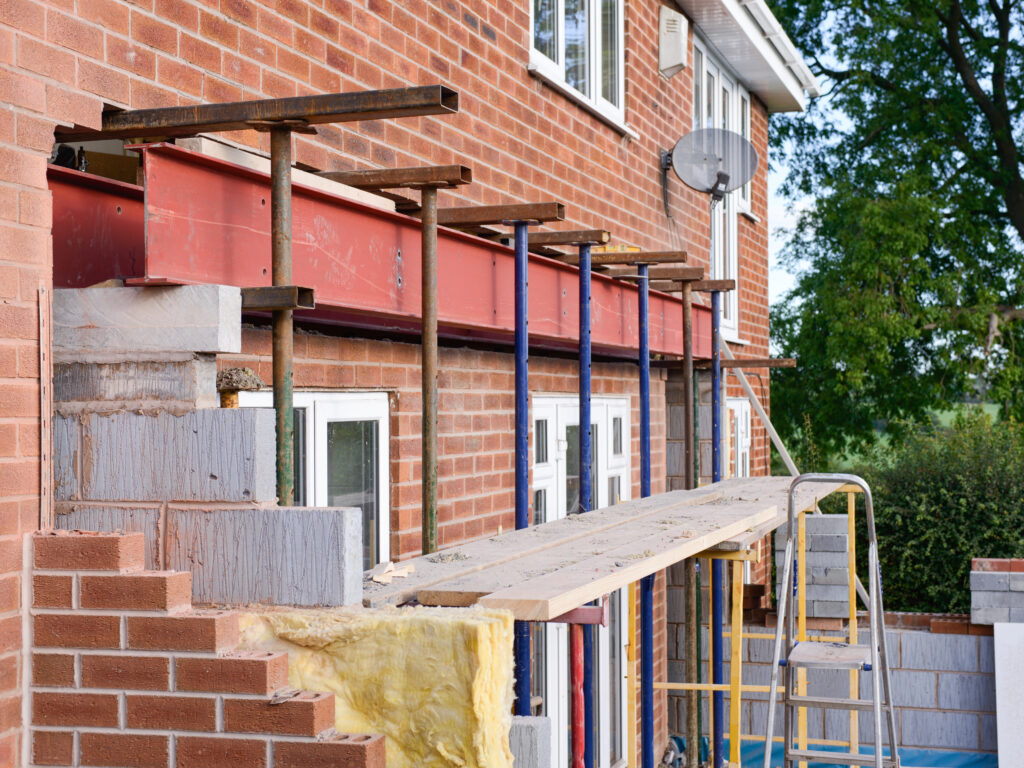 A steel beam installed in a home extension project, providing structural support and showcasing its durability and importance in modern construction.